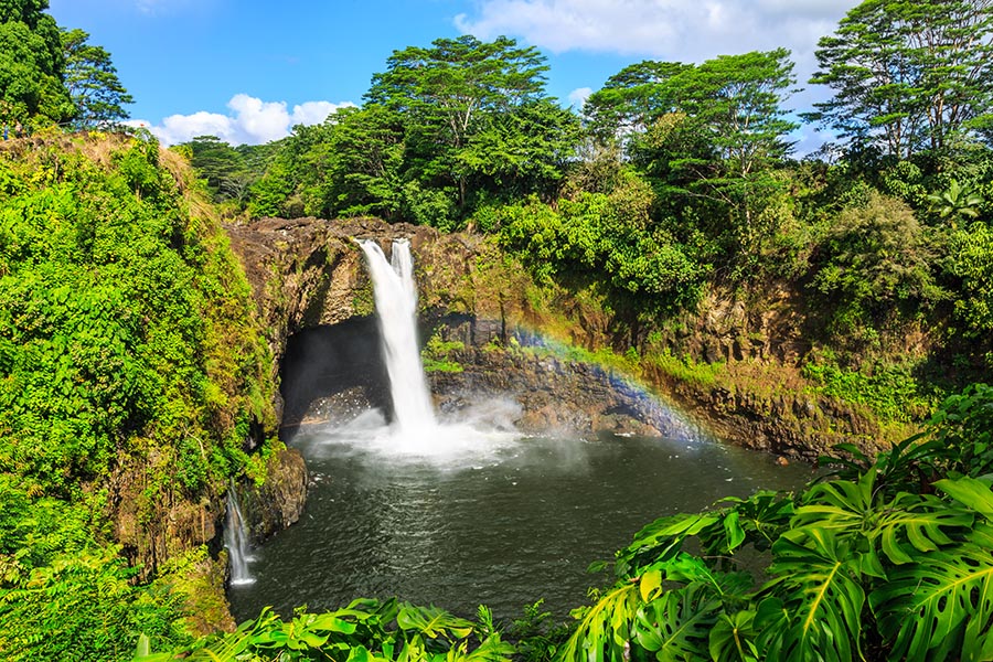 Hilo, HI Insurance - Rainbow Falls, a Waterfall in the Wailuku River in Hilo, a Rainbow Crossing Between the Rocky Arch